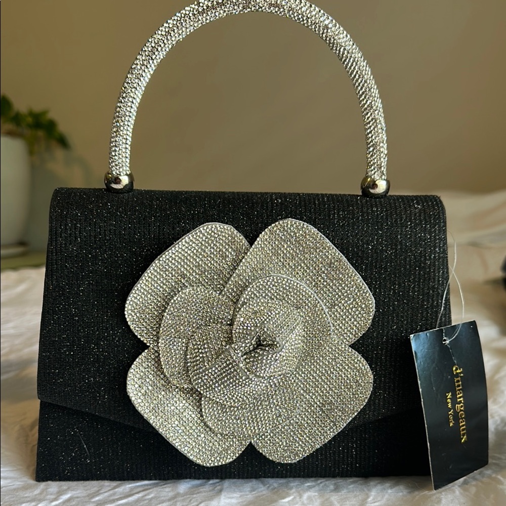 Chic Black and Silver Clutch with Floral Accent